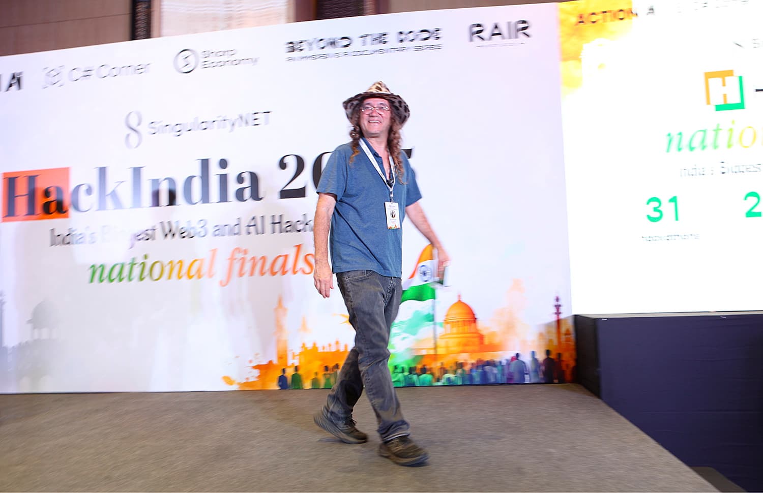 A team presenting on stage at the HackIndia finals